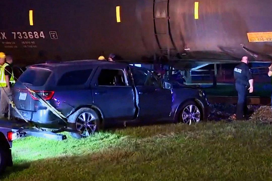 Police Bodycam Video Rescue After SUV Hits Train